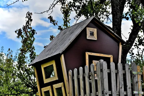 We'll wrap up our list of crazy garden ideas with a treehouse in a small garden.